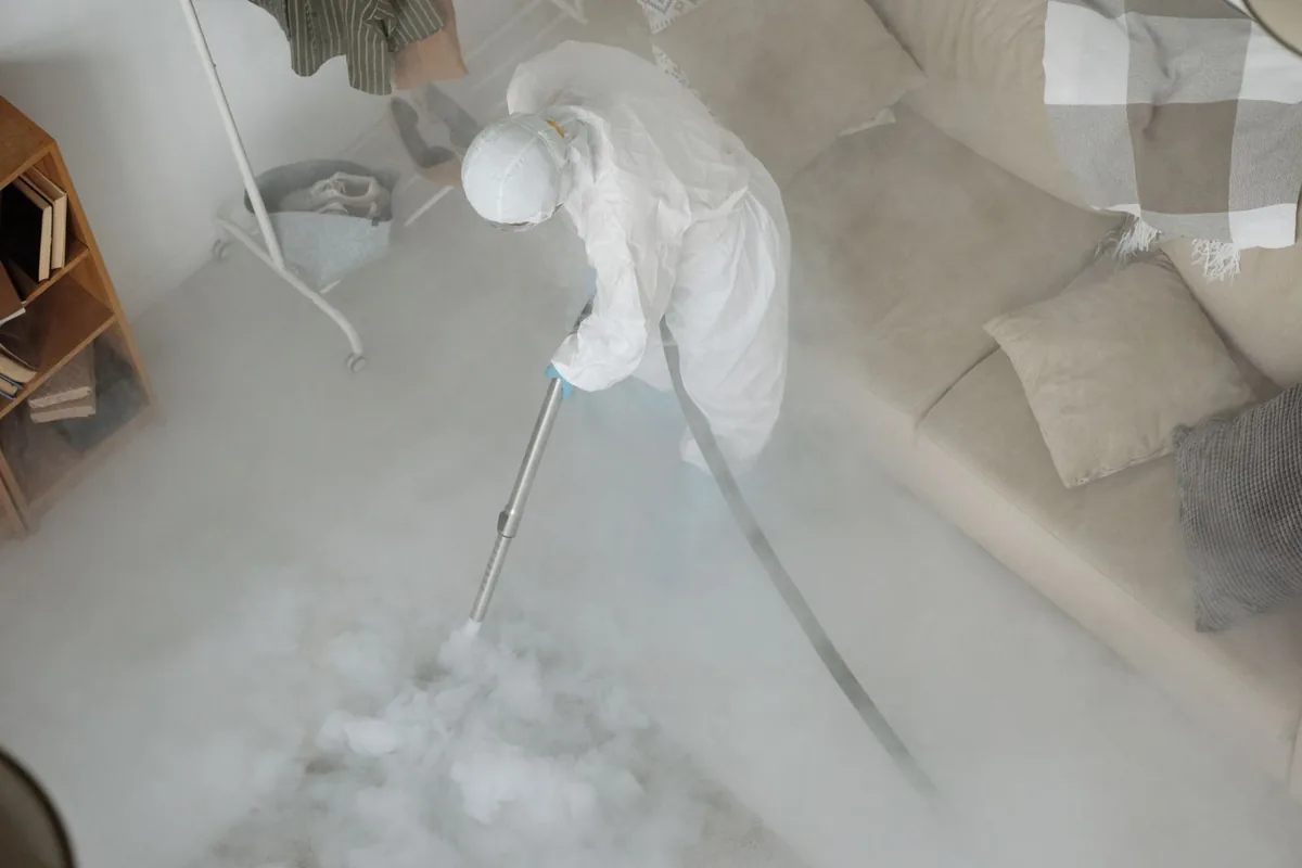 Biohazard cleanup technician in protective equipment, Pymatuning Central, PA